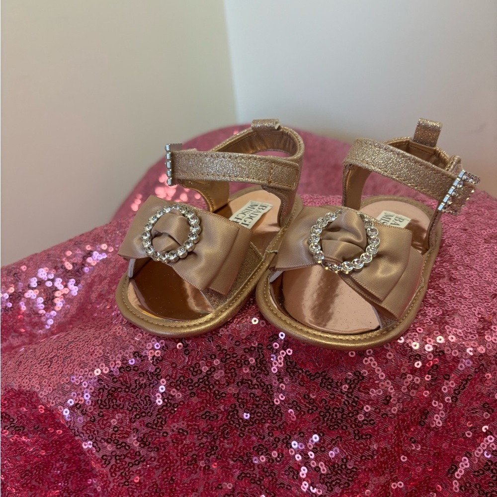Shiny pink baby shoes